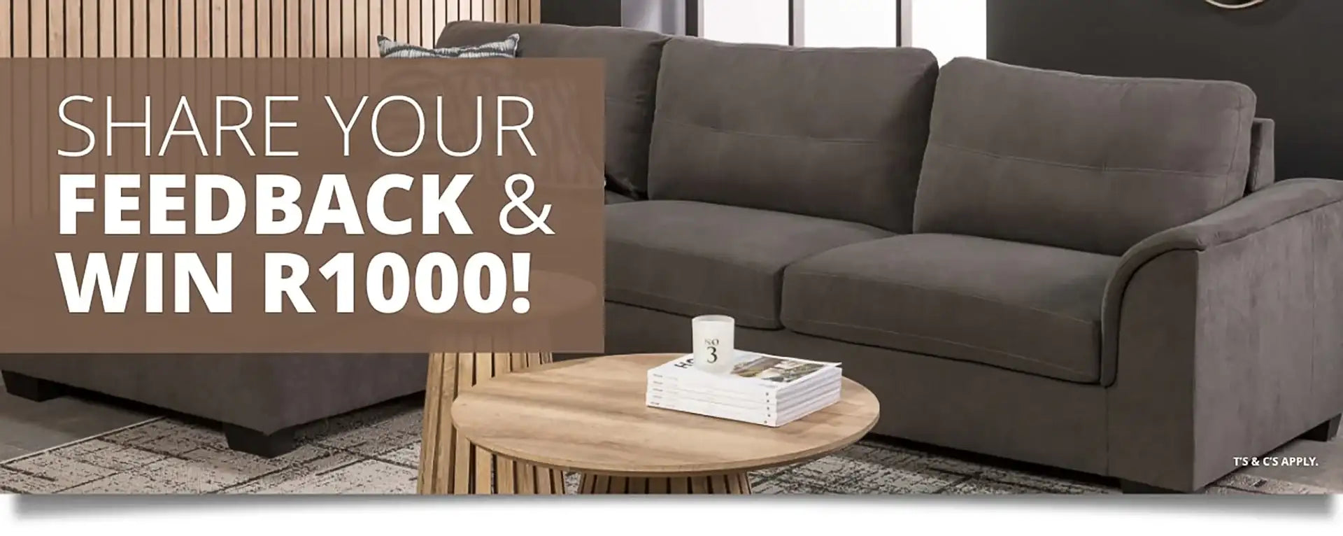 Dark gray fabric sectional sofa with rounded armrests and a modern, minimalist design.