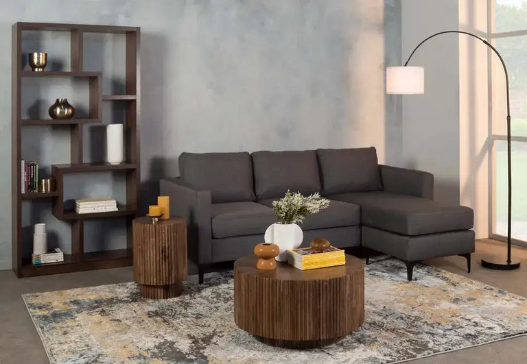 Dark gray sectional sofa with a chaise lounge and sleek, modern design