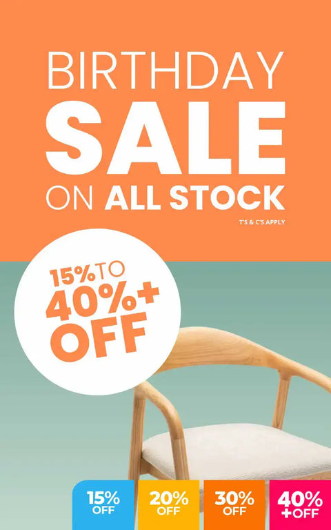 A minimalist wooden chair with a light-colored frame and white cushion.